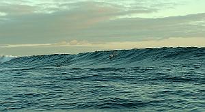 Paddling for one of the larger ones on our first session at Chicken Hill in the Galapagos Islands.